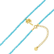Kette mit blauen Glasperlen und Palmen-Anhänger